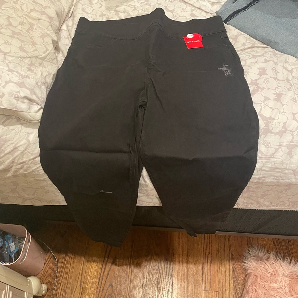 BNWT black jeans. Lightly distressed…hole on left knee, by design